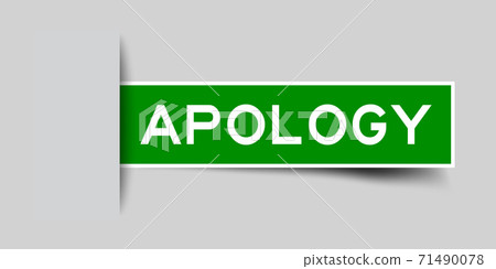 Inserted green color label sticker with word apology on gray background 71490078