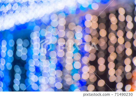 Winter season elegant bokeh background. Seasonal cool light decorative abstract design element..Blue bokeh glitter texture Christmas abstract background.Bokeh light dot in Christmas and New Year decor 71490230