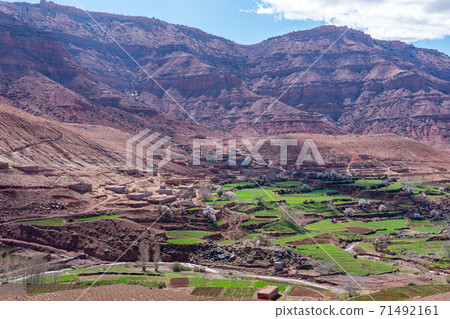Adobe kasbah in mountain villages in the High Atlas Mountains. Morocco. Adobe kasbah in mountain villages in the High Atlas Mountains. Morocco. 71492161