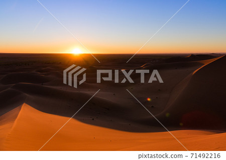 Huge desert dunes of Erg Chigaga, at the gates of the Sahara, al amanecer. Morocco. Concept of travel and adventure. 71492216