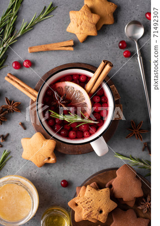 hot cranberry tea with lemon and honey in a white mug hot cranberry tea with lemon and honey in a white mug 71492307
