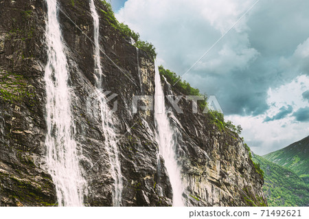 Geirangerfjord, Norway. The Seven Sisters waterfalls In Geirangerfjorden. Famous Norwegian Landmark And Popular Destination In Summer Day 71492621