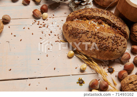christmas decoration in rustic style and holiday background, still life on wooden backdrop, bread, nuts and other 71493102