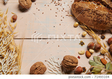 christmas decoration in rustic style and holiday background, still life on wooden backdrop, bread, nuts and other 71493104