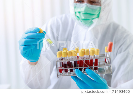 Researchers test blood samples in the laboratory. Researchers are inventing vaccines to treat COVID-19 virus. Researchers test blood samples in the laboratory. Researchers are inventing vaccines to treat COVID-19 virus. 71493400