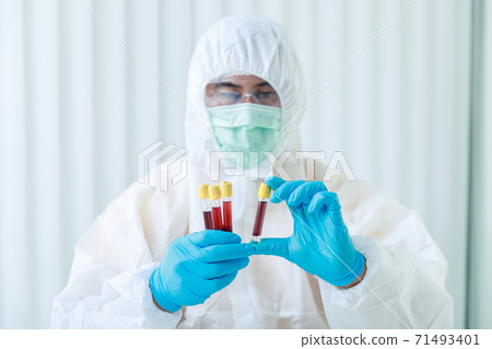 Researchers compare blood samples of patients infected with the disease in the laboratory. Researchers are inventing vaccines to treat COVID-19 virus. Researchers compare blood samples of patients infected with the disease in the laboratory. Researchers are inventing vaccines to treat COVID-19 virus. 71493401