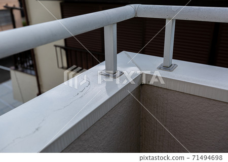 Dirt on the balcony railing 71494698