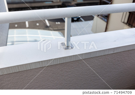 Dirt on the balcony railing 71494709