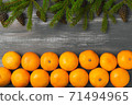 Mandarins for with fir branches Merry Christmas and Happy New Year horizontal layout 71494965