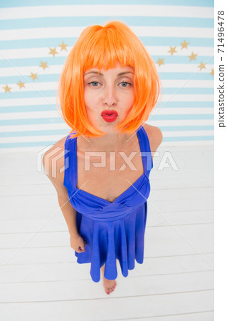 party girl with crazy look. crazy girl send kiss to a camera. party girl with crazy look. crazy girl send kiss to a camera. 71496478