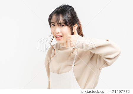 Young woman doing a like gesture 71497773