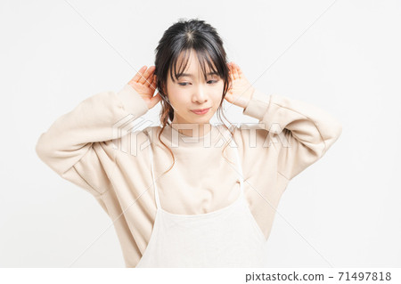 Young woman listening Young woman listening 71497818
