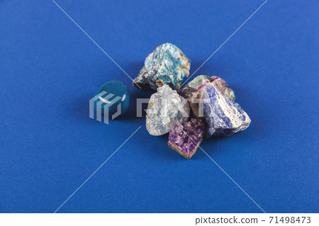 Natural minerals, precious stones on classic blue background 71498473