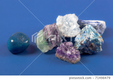 Natural minerals, precious stones on classic blue background 71498479