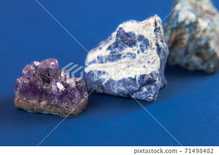 Natural minerals, precious stones on classic blue background 71498482