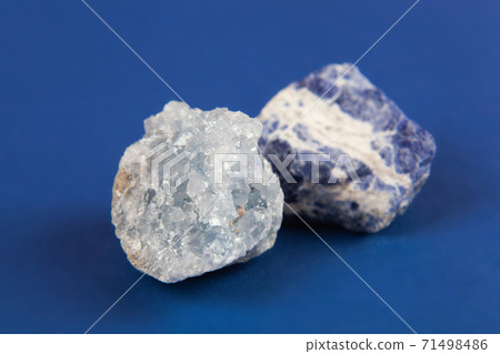 Natural minerals, precious stones on classic blue background Natural minerals, precious stones on classic blue background 71498486