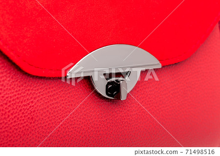 handbag with leather and suede red color, female accessory close up details lock closing bag, nobody. 71498516