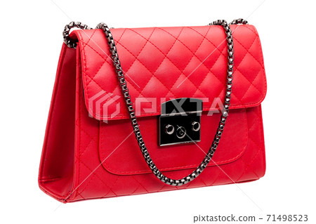woman`s handbag with red leather square pattern and metal strap, side view isolated object on a white background. 71498523