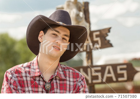 Cowboy on sign background. Cowboy on sign background. 71507380