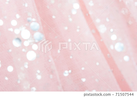 Pink tulle fabric with sequins as background and texture, close-up 71507544