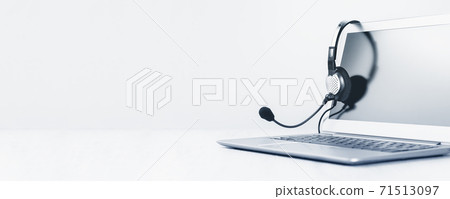 Laptop with headphones on white desk 71513097