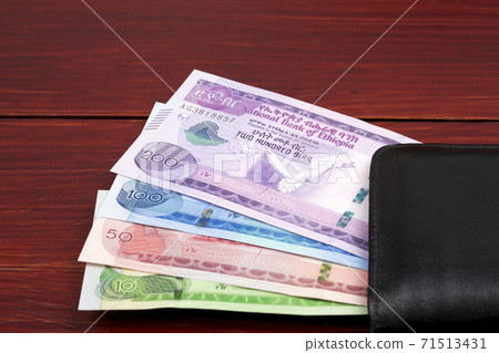 Ethiopian money in the black wallet 71513431