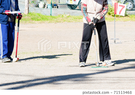 Elderly people enjoying ground golf 71513468