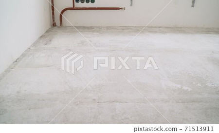 Floors before treatment. Concrete floors in a new apartment. over view,repair cracked floor before waterproof cement treatment system. 71513911