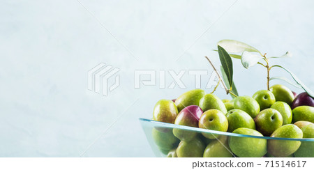 Freshly picked raw green olives in glass bowl 71514617