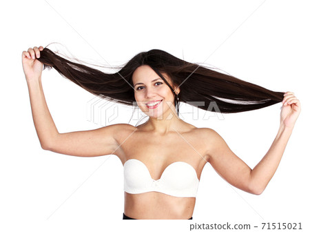 happy young attractive woman holding her hair happy young attractive woman holding her hair 71515021