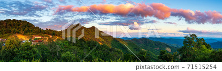 Akha village in the mountains of North Laos, sunset dramatic sky. Remote tribal village travel destination for tribal trekking, Akha ethnic group and minority. Akha village in the mountains of North Laos, sunset dramatic sky. Remote tribal village travel destination for tribal trekking, Akha ethnic group and minority. 71515254