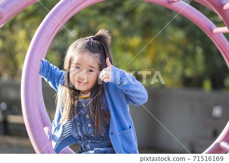 A smiling 4-year-old girl, a smiling 5-year-old girl A smiling 4-year-old girl, a smiling 5-year-old girl 71516169