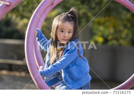A smiling 4-year-old girl, a smiling 5-year-old girl A smiling 4-year-old girl, a smiling 5-year-old girl 71516175