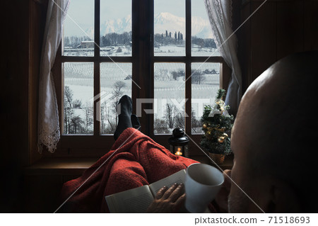 A man reading a book 71518693