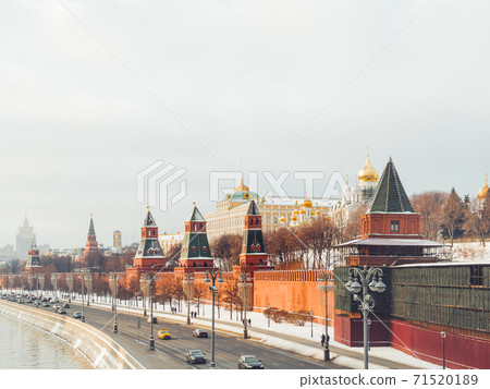 Senate Palace behind red brick walls of Kremlin. Architectural landmark in Moscow, Russia. Senate Palace behind red brick walls of Kremlin. Architectural landmark in Moscow, Russia. 71520189