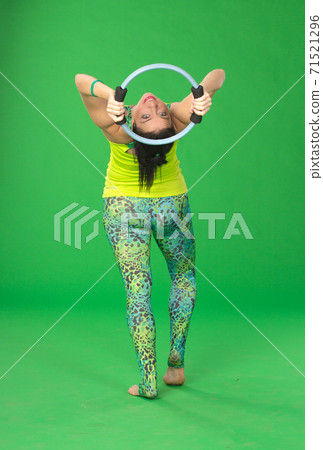 Woman doing pilates with ring 71521296