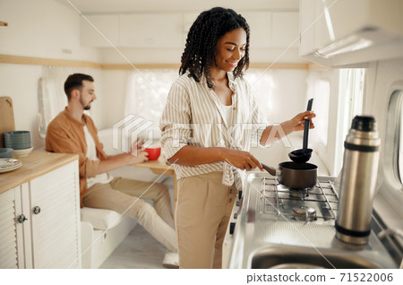 Love couple cooking in rv kitchen, camping Love couple cooking in rv kitchen, camping 71522006