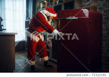 Bad impudent Santa claus opens the refrigerator Bad impudent Santa claus opens the refrigerator 71522191
