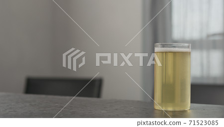 kombucha highball glass on concrete countertop with copy space 71523085