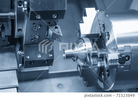 The CNC lathe machine thread cutting the metal shaft part. The CNC lathe machine thread cutting the metal shaft part. 71523849