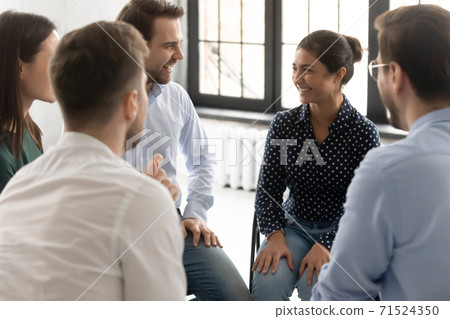Friendly diverse people taking part in group therapy session 71524350