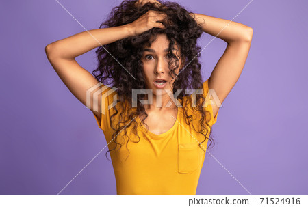 Bad Hair Day. Crazy Young Woman Touching Head And Looking At Camera Bad Hair Day. Crazy Young Woman Touching Head And Looking At Camera 71524916