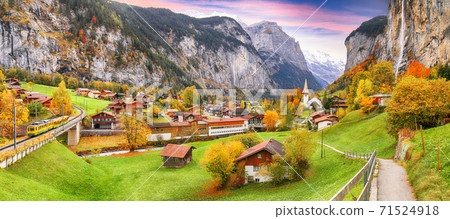 Amazing autumn landscape of touristic alpine village Lauterbrunnen Amazing autumn landscape of touristic alpine village Lauterbrunnen 71524918