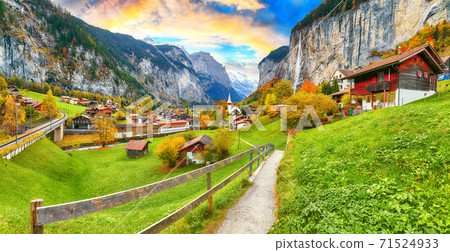 Amazing autumn landscape of touristic alpine village Lauterbrunnen Amazing autumn landscape of touristic alpine village Lauterbrunnen 71524933