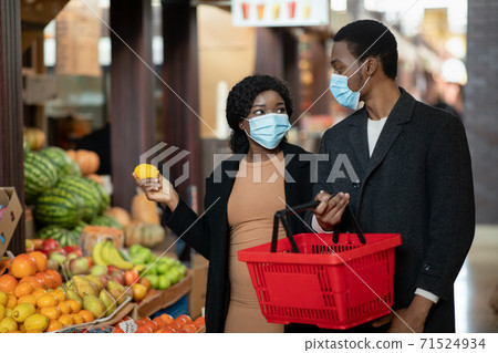 Grocery shopping during covid-19 pandemic and social distancing Grocery shopping during covid-19 pandemic and social distancing 71524934