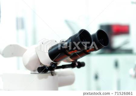 Microscope in the dental office 71526861