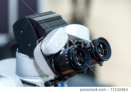 Microscope in the dental office 71526863