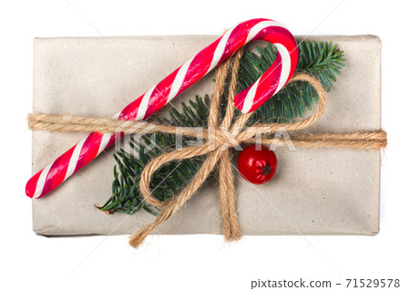 Wrapped Christmas gift on white Wrapped Christmas gift on white 71529578