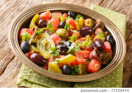 Homemade Algerian salad of tomatoes and green peppers Chlada felfel close-up on the table. horizontal 71530474