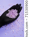 Flavored, odorous salt for spa and bath. Salt on a female hand. Natural crystallized product from the sea 71530900
